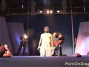extreme fetish demonstrate on public display stage
